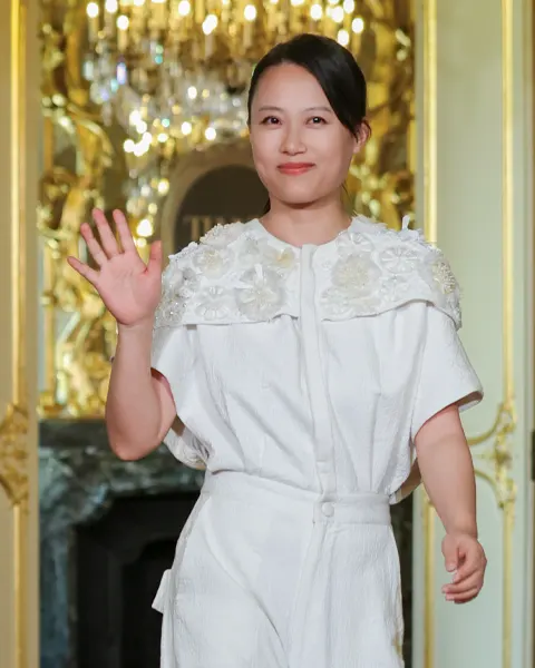 Portrait representing TIANXI, the Suzhou-born Chinese couture house, at Perspectives Croisées SS27 during Paris Fashion Week.